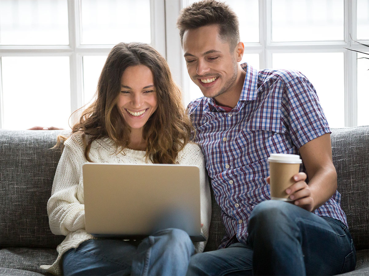 couple excitedly reading warranty terms