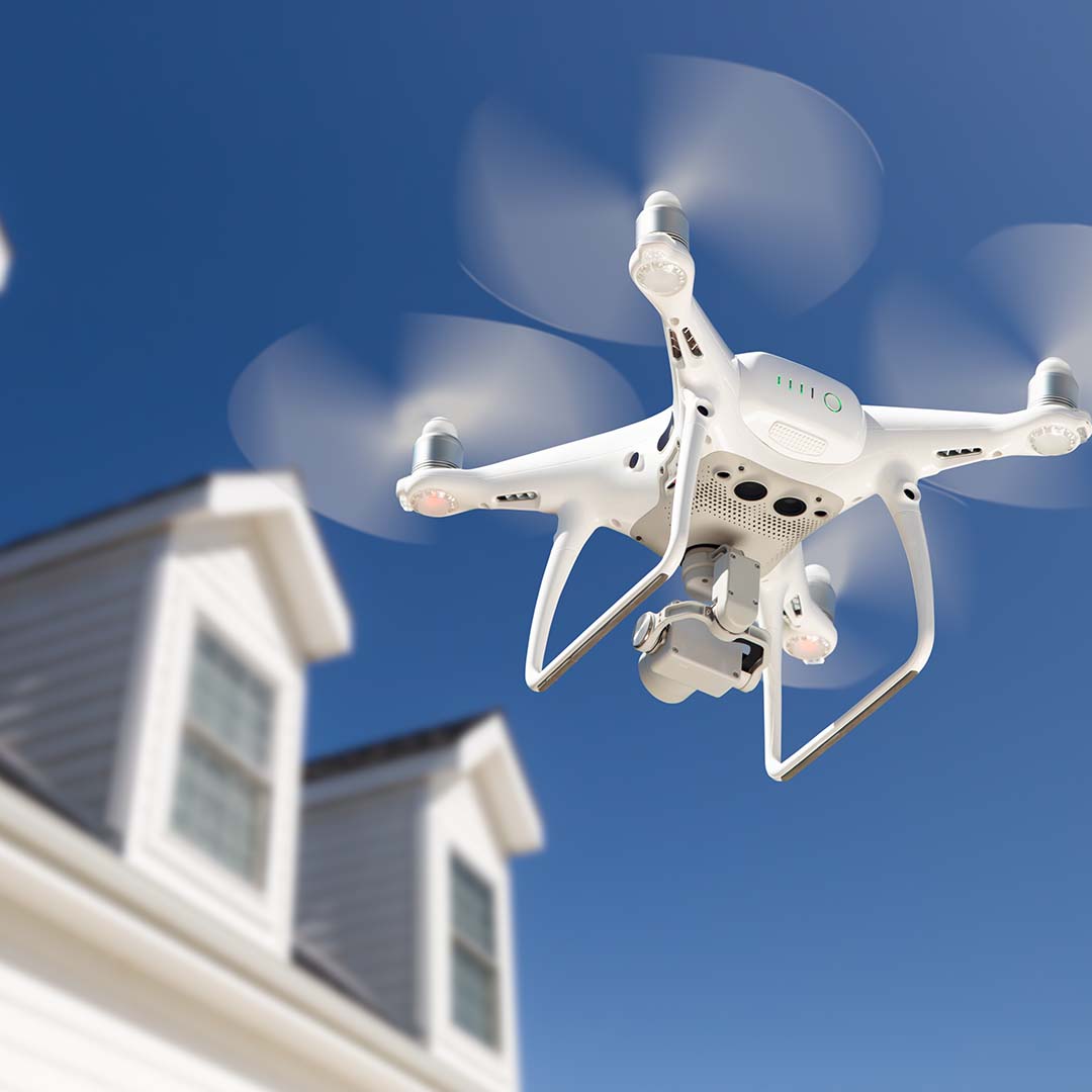 A drone inspecting a roof